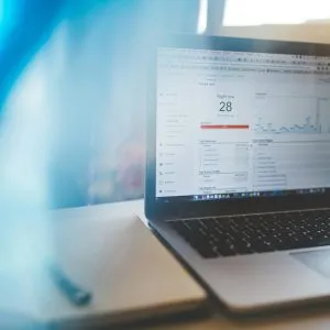 Laptop displaying Google Analytics in a modern workspace, highlighting digital analytics and technology.