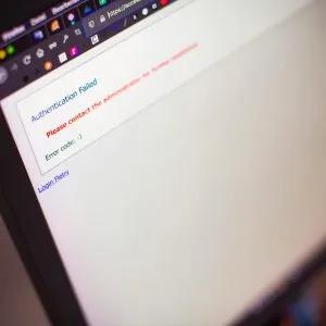 Close-up of a computer screen displaying an authentication failed message.